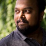 man wearing black polo shirt outdoor during daytime